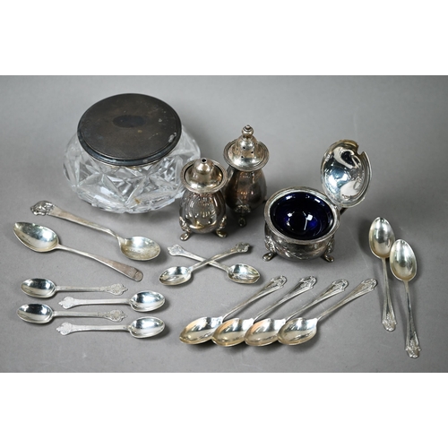 65 - A heavy quality silver three-piece condiment set, various teaspoons and a silver-topped glass powder... 