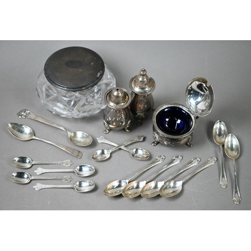 65 - A heavy quality silver three-piece condiment set, various teaspoons and a silver-topped glass powder... 