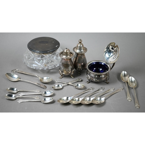 65 - A heavy quality silver three-piece condiment set, various teaspoons and a silver-topped glass powder... 