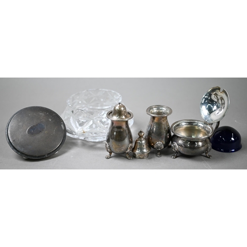 65 - A heavy quality silver three-piece condiment set, various teaspoons and a silver-topped glass powder... 