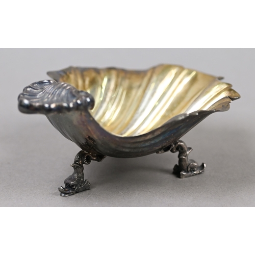 67 - A Miracoli (Milan) .800 grade and parcel-gilt shell dish on dolphin supports, 3.8oz, 13cm x 10cm, to... 