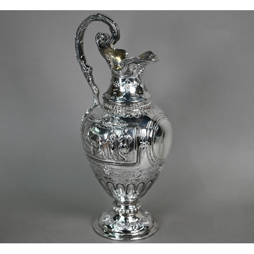 70 - A Victorian silver wine ewer in the Renaissance manner, of baluster form with hinged cover and scrol... 