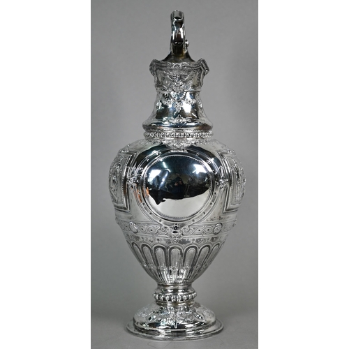 70 - A Victorian silver wine ewer in the Renaissance manner, of baluster form with hinged cover and scrol... 