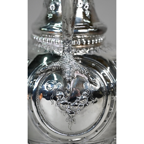 70 - A Victorian silver wine ewer in the Renaissance manner, of baluster form with hinged cover and scrol... 