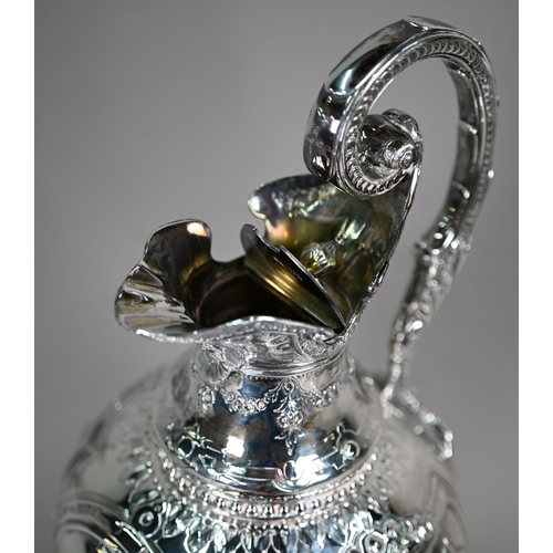 70 - A Victorian silver wine ewer in the Renaissance manner, of baluster form with hinged cover and scrol... 