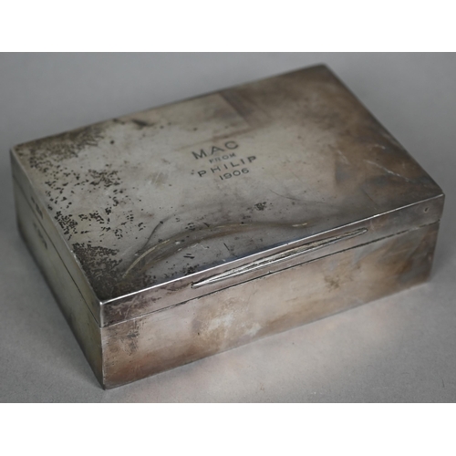 72 - An Edwardian silver playing-cards box, the green Morocco leather lining fitted with two compartments... 