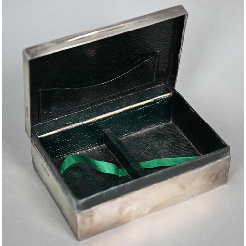 72 - An Edwardian silver playing-cards box, the green Morocco leather lining fitted with two compartments... 