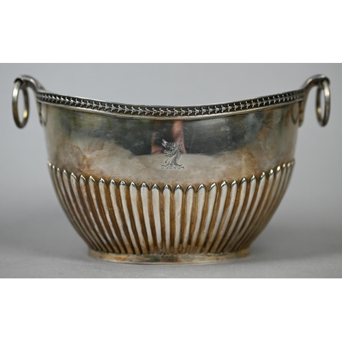 75 - A Victorian silver half-reeded sugar basin of elliptical form with ring handles, Frederick Brasted, ... 