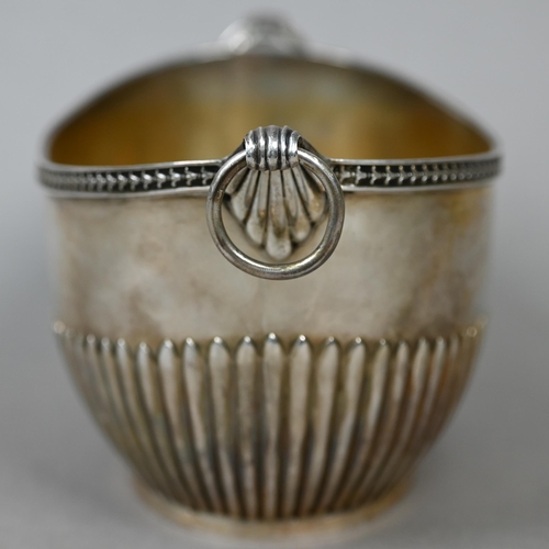 75 - A Victorian silver half-reeded sugar basin of elliptical form with ring handles, Frederick Brasted, ... 