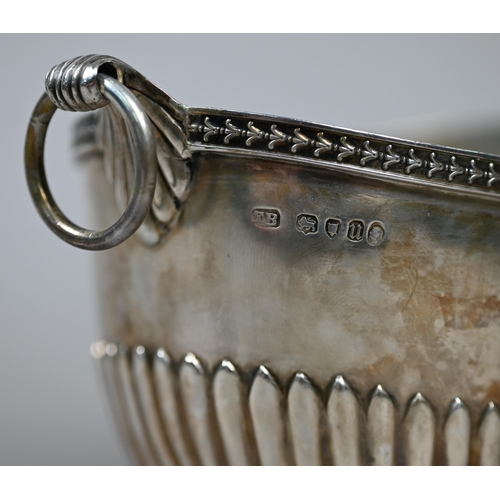 75 - A Victorian silver half-reeded sugar basin of elliptical form with ring handles, Frederick Brasted, ... 