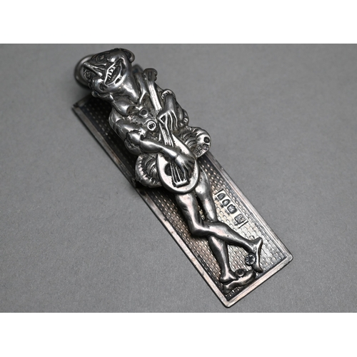 76 - A Victorian silver novelty spring-clip, featuring a humorous ecstatic troubadour, Rosenthal, Jacob &... 