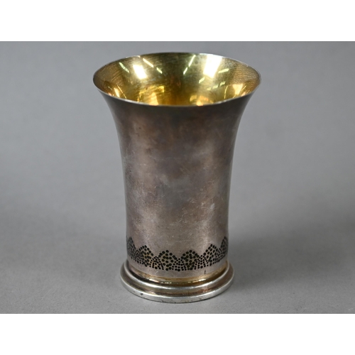 77 - Frances Loyen: a silver beaker with flared rim and gilt interior, the base pierced and decorated wit... 