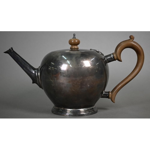 80 - A heavy quality silver bullet-shaped tea pot on the 18th Century manner, with wooden finial and scro... 