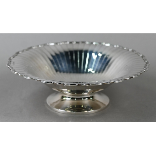 87 - An Art Deco silver dish with radiating shallow flutes and moulded rim, on raised foot, Selfridge &am... 