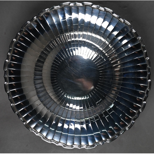 87 - An Art Deco silver dish with radiating shallow flutes and moulded rim, on raised foot, Selfridge &am... 