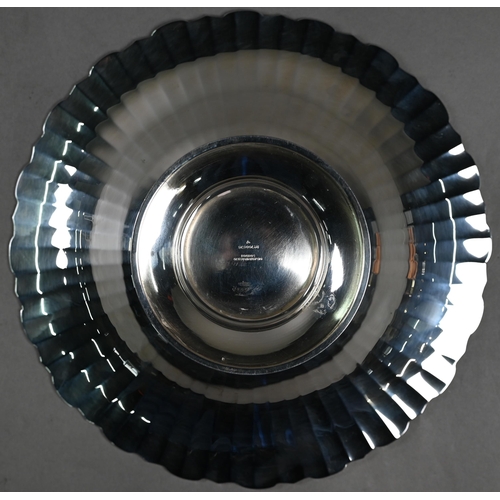 87 - An Art Deco silver dish with radiating shallow flutes and moulded rim, on raised foot, Selfridge &am... 