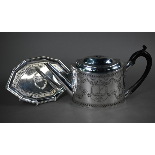 89 - A George III silver teapot of elliptical form with bright-cut and wrigglework engraving and stag's h... 