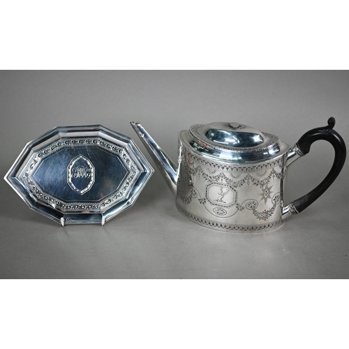 89 - A George III silver teapot of elliptical form with bright-cut and wrigglework engraving and stag's h... 