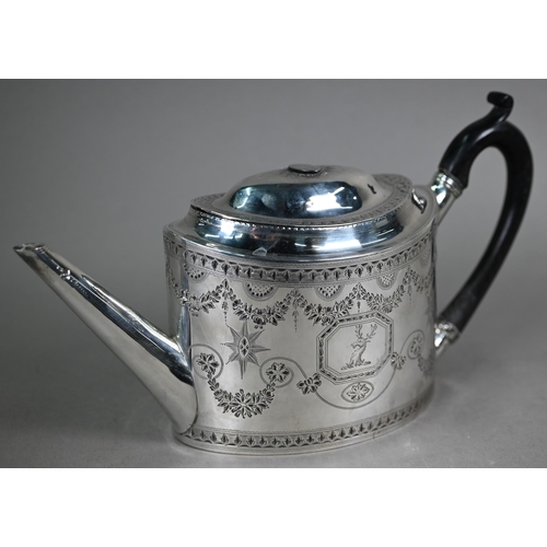 89 - A George III silver teapot of elliptical form with bright-cut and wrigglework engraving and stag's h... 