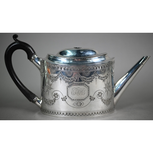 89 - A George III silver teapot of elliptical form with bright-cut and wrigglework engraving and stag's h... 