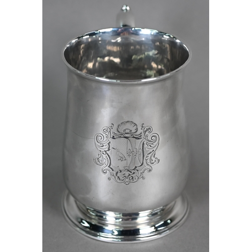 90 - A George III silver baluster pint mug with scroll handle and moulded flared foot, maker -F (rubbed),... 