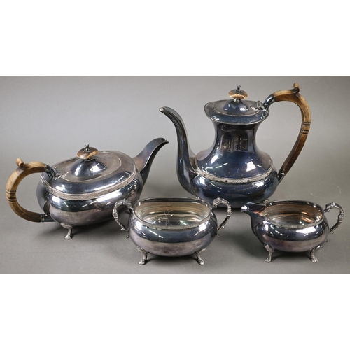 91 - A heavy quality silver four-piece tea/coffee service with simulated ivory handles and chased pad fee... 