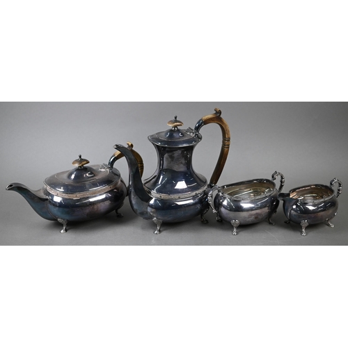 91 - A heavy quality silver four-piece tea/coffee service with simulated ivory handles and chased pad fee... 