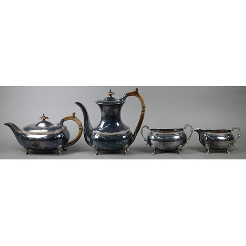 91 - A heavy quality silver four-piece tea/coffee service with simulated ivory handles and chased pad fee... 