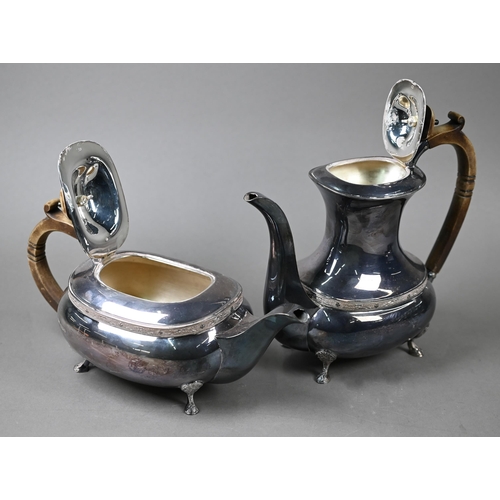 91 - A heavy quality silver four-piece tea/coffee service with simulated ivory handles and chased pad fee... 