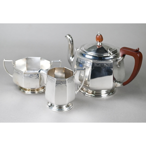 94 - A heavy quality Art Deco silver tea set of octagonal form, with engraved decoration and composite mo... 