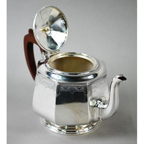 94 - A heavy quality Art Deco silver tea set of octagonal form, with engraved decoration and composite mo... 