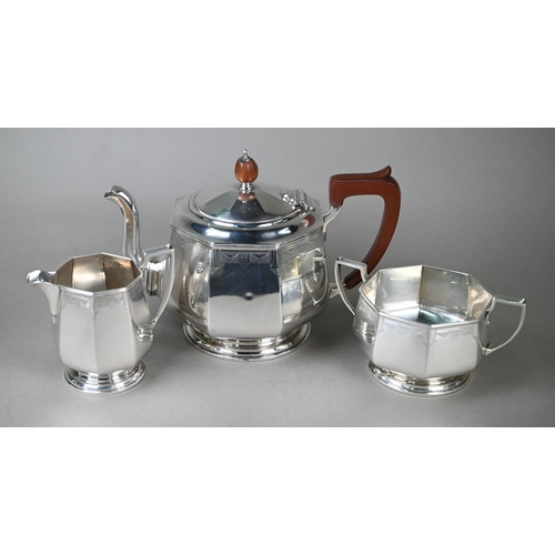 94 - A heavy quality Art Deco silver tea set of octagonal form, with engraved decoration and composite mo... 