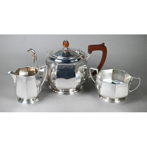 94 - A heavy quality Art Deco silver tea set of octagonal form, with engraved decoration and composite mo... 