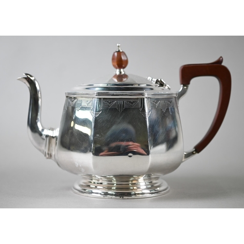 94 - A heavy quality Art Deco silver tea set of octagonal form, with engraved decoration and composite mo... 