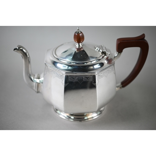 94 - A heavy quality Art Deco silver tea set of octagonal form, with engraved decoration and composite mo... 