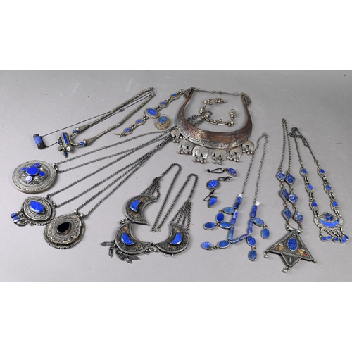 303 - A collection of various Afghan jewellery items including white metal pendants, necklaces, etc some s... 