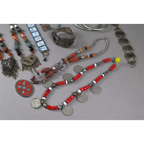 304 - A collection of white metal and other jewellery items including Maldivian coral and bead necklaces, ... 