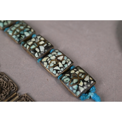 304 - A collection of white metal and other jewellery items including Maldivian coral and bead necklaces, ... 