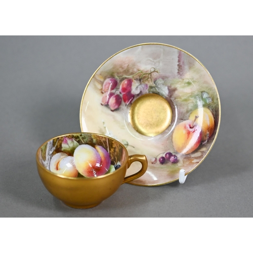 586 - A Royal Worcester miniature gilded cabinet cup and saucer painted with fruit, the 5.8 cm diameter cu... 