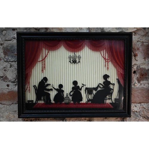 1026 - An early Victorian silhouette, reverse-painted under glass, family scene, 24 x 34 cm, framed (glass ... 