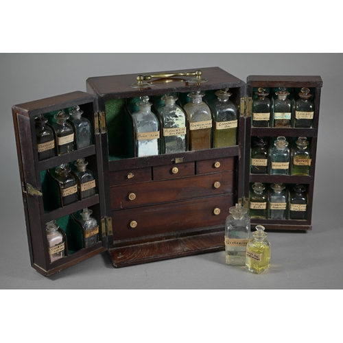 1154 - A 19th century mahogany apothecary box, fitted with glass bottles and drawers with ivory knobs, encl... 