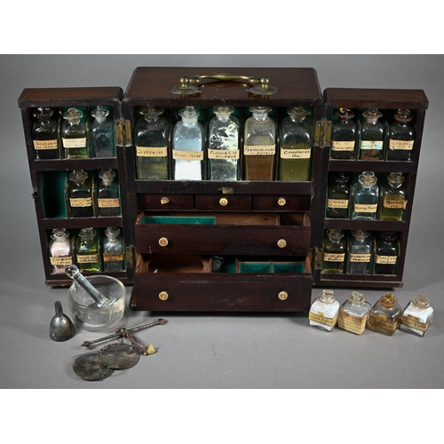 1154 - A 19th century mahogany apothecary box, fitted with glass bottles and drawers with ivory knobs, encl... 