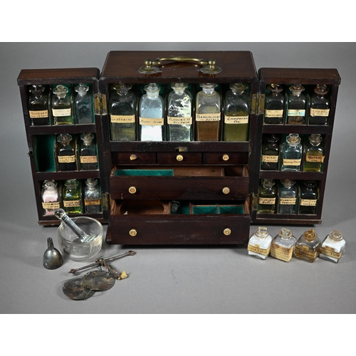 1154 - A 19th century mahogany apothecary box, fitted with glass bottles and drawers with ivory knobs, encl... 