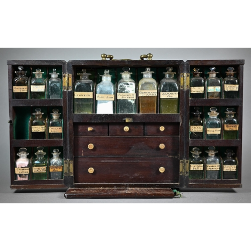 1154 - A 19th century mahogany apothecary box, fitted with glass bottles and drawers with ivory knobs, encl... 