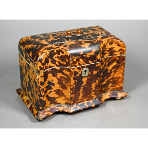 1160 - A Victorian serpentine-front tortoiseshell tea caddy with two inner lidded compartments, on ivory ba... 