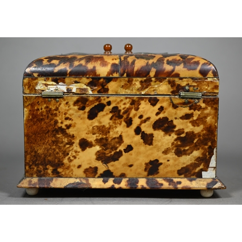 1160 - A Victorian serpentine-front tortoiseshell tea caddy with two inner lidded compartments, on ivory ba... 