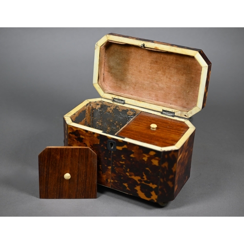 1161 - A Regency tortoiseshell sarcophagus tea caddy with moulded top enclosing two lidded compartments, on... 