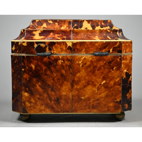 1161 - A Regency tortoiseshell sarcophagus tea caddy with moulded top enclosing two lidded compartments, on... 