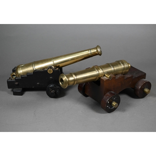 1163 - A 19th century brass model cannon with 26 cm brass barrel on wooden carriage, to/w another, later ca... 