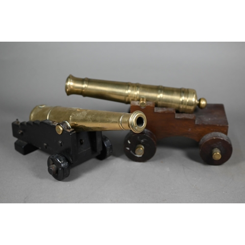 1163 - A 19th century brass model cannon with 26 cm brass barrel on wooden carriage, to/w another, later ca... 